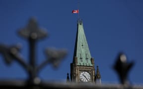 A Canadian flag flies at half-mast on top of the Peace Tower to mourn the victims of the of the Nova Scotia shooting April 20, 2020 in Ottawa, Canada.