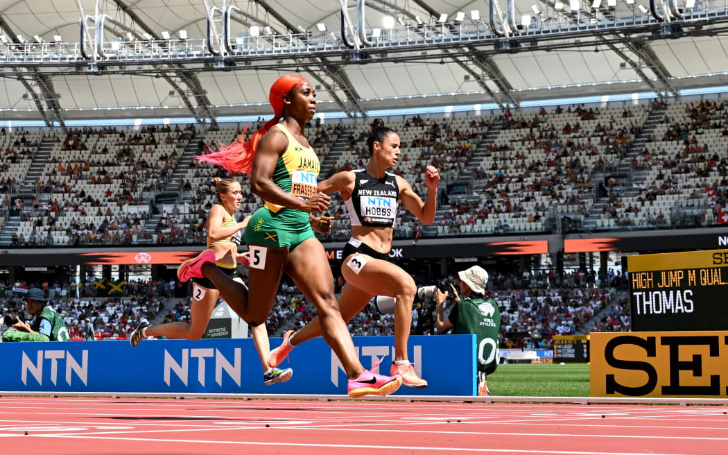 Shelly-Ann Fraser-Pryce and Zoe Hobbs at the 2023 athletics world championships.