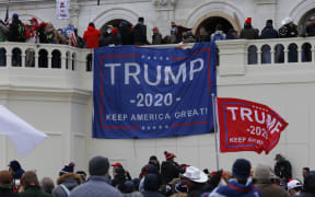 Supporters of US President Donald Trump storm the US Capitol during a rally to contest the certification of the 2020 US presidential election results by Congress at the Capitol Building in Washington.