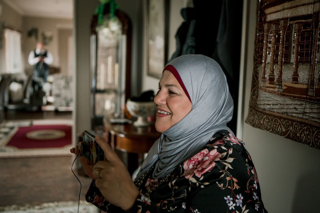 Mayssaa Sheik Al Ard takes a picture in her home