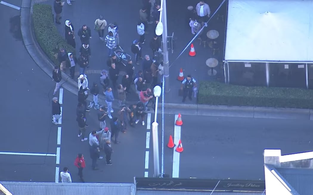 Police were seen speaking to crowds gathered at the scene in the wake of the shooting.