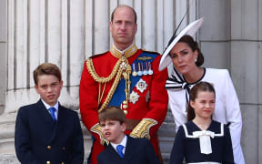 (L-R) Britain's Prince George of Wales, Britain's Prince William, Prince of Wales, Britain's Prince Louis of Wales, Britain's Catherine, Princess of Wales, and Britain's Princess Charlotte of Wales, stand on the balcony of Buckingham Palace after attending the King's Birthday Parade "Trooping the Colour" in London on June 15, 2024.