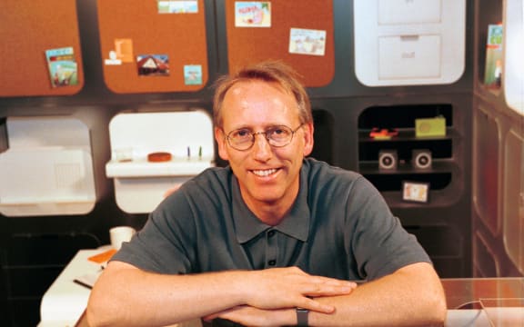 SAN FRANCISCO - AUGUST 28:  Scott Adams, famed creator of the comic strip DILBERT stands within "Dilbert's Ultimate Cubicle" which offers practical and humorous concepts for the future workplace office, Tuesday, August 28, 2001 in San Francisco, California. The cubicle- which includes a hammock, aquarium, rotating floor modules, shoe polisher and a self-timing guest seat - was designed by IDEO, a world leader of innovation and design and was created in response to the thousands of e-mails Adams has received from disgruntled workers across the country. (Photo by Bob Riha, Jr./Getty Images)