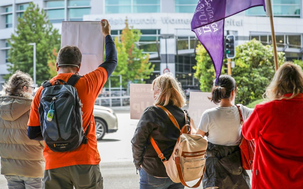 Christchurch health workers protest holiday act payment delays outside hospital on 11 March 2024.