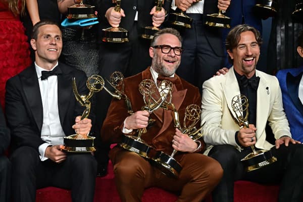 Canadian-US actor Seth Rogen poses (C) in the press room with the  awards for Outstanding Writing for a Comedy Series, Outstanding Directing for a Comedy Series, Outstanding Lead Actor in a Comedy Series and Outstanding Comedy Series for "The Studio" during the 77th Primetime Emmy Awards at the Peacock Theatre at LA Live in Los Angeles on September 14, 2025. (Photo by Frederic J. Brown / AFP) / RESTRICTED TO EDITORIAL USE