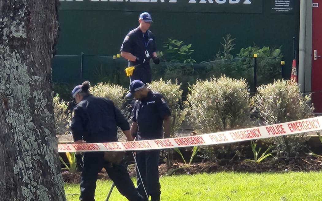 Police search the scene of a death in Auckland's Blockhouse Bay in August 2024.