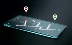 Map and navigation icons on transparent smartphone screen. GPS or Global Positioning System is a network of orbiting satellites that send precise details of their position in space back to earth.