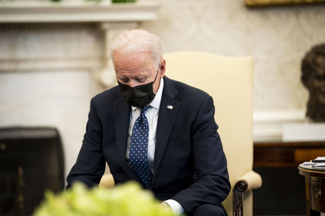 President Joe Biden pauses during a meeting with the leadership of the Congressional Hispanic Caucus in the Oval Office of the White House.