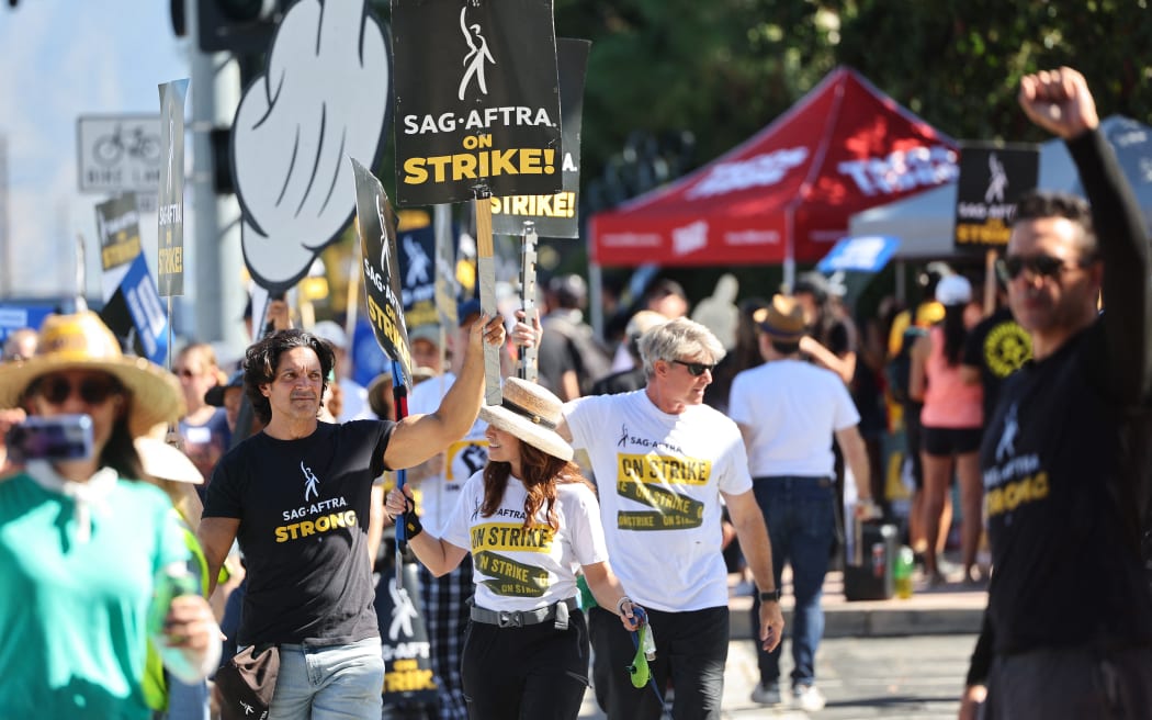 Striking SAG-AFTRA members and supporters picket outside Disney Studios on day 95 of their strike against the Hollywood studios, on 16 October 2023, in Burbank, California.