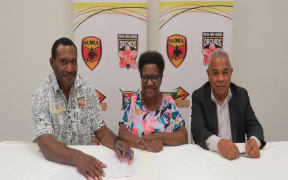 New PNG Orchids coach Nigel Hukula, with Executive Management Committee Chair Ms Ruth Waram and PNGRFL CEO Reatau Rau.
