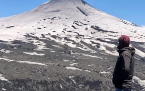 University of Canterbury Research Engineer Dr Alberto Ardid, shown here on the summit of Villarrica volcano in southern Chile, has co-led a new study that could help forecast eruptions.