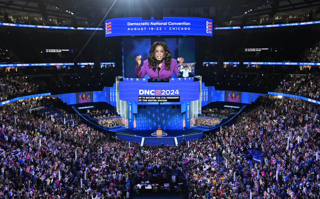 US producer/actress Oprah Winfrey speaks on the third day of the Democratic National Convention (DNC) at the United Center in Chicago, Illinois, on August 21, 2024. Vice President Kamala Harris will formally accept the party’s nomination for president at the DNC which runs from August 19-22 in Chicago. (Photo by MANDEL NGAN / AFP)