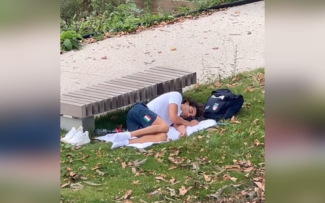 Gold medal swimmer Thomas Ceccon spotted sleeping outside after complaining about Olympic living quarters