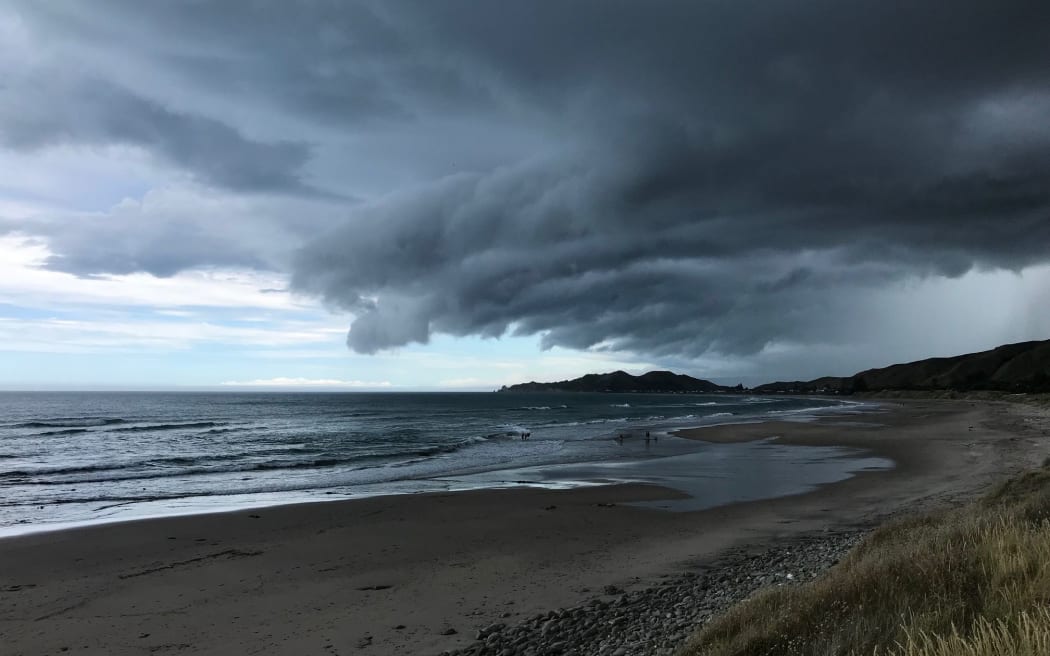 Storm clouds over Tuahine point at Wainui Beach near Gisborne.
