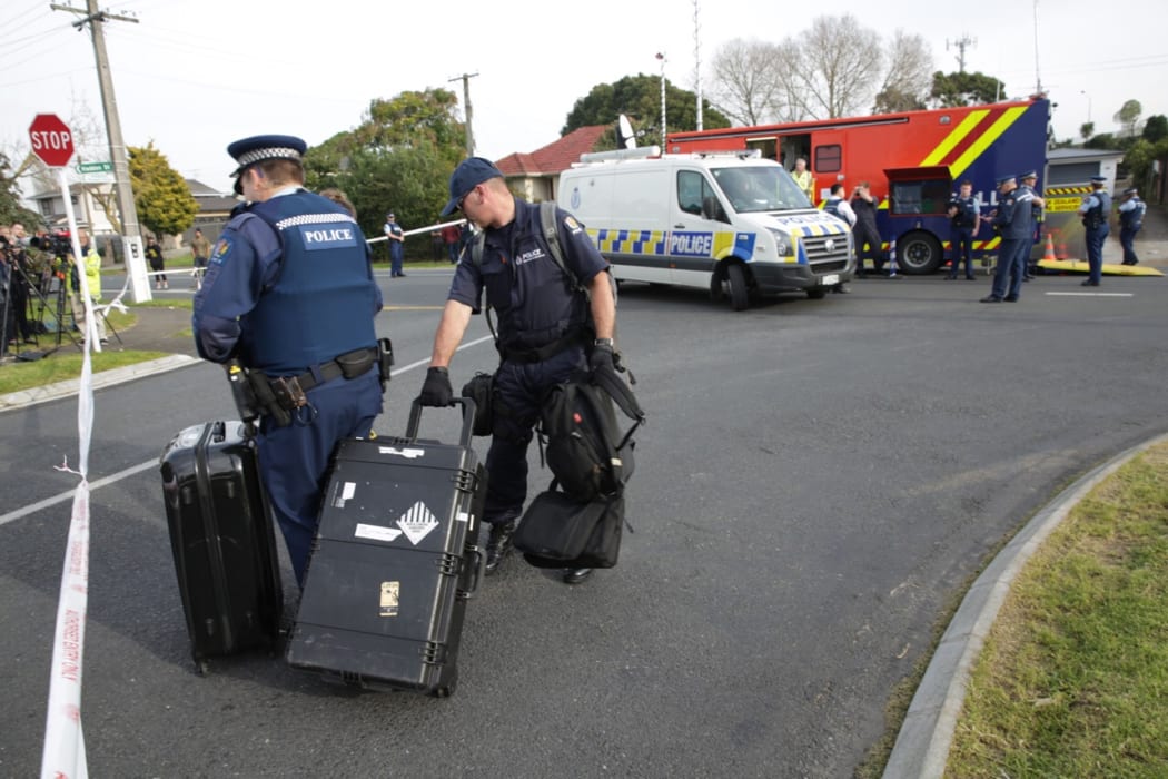 A police specialist search group arrives at the property at the centre of the cordon on Henwood Road in Mangere
