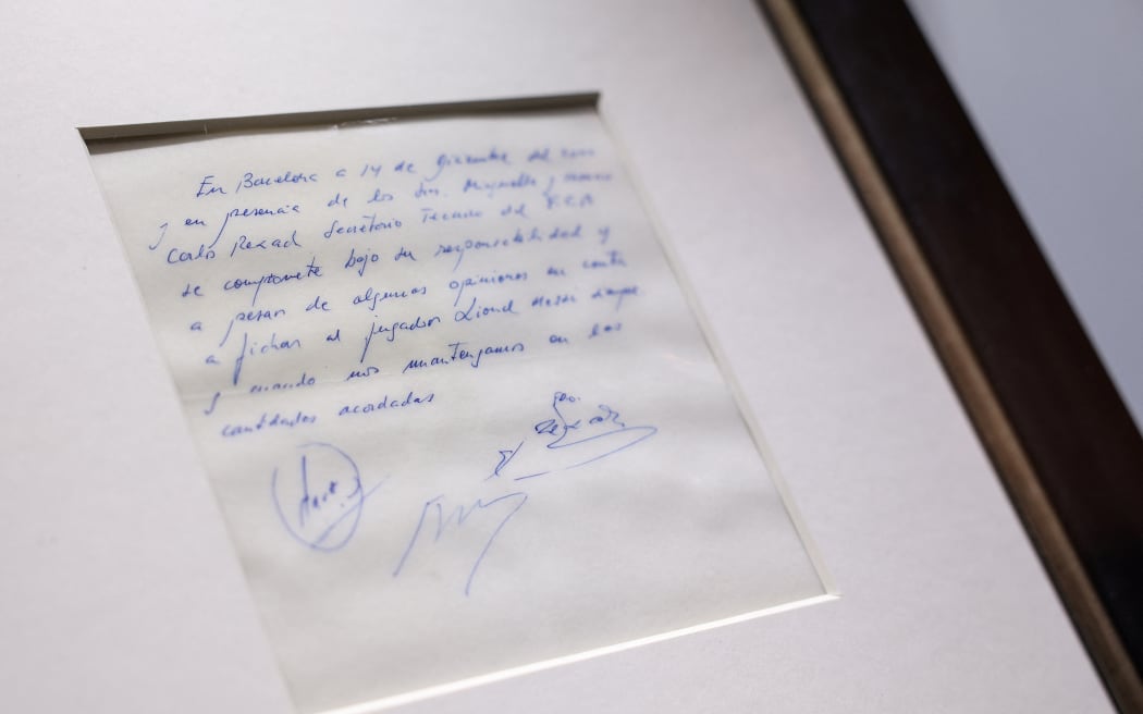 The napkin on which the 13-year-old Argentinian football player Lionel Messi was promised his first contract with FC Barcelona, photographed in London on 8 May, 2024, before its auction. (Photo by Adrian DENNIS / AFP)