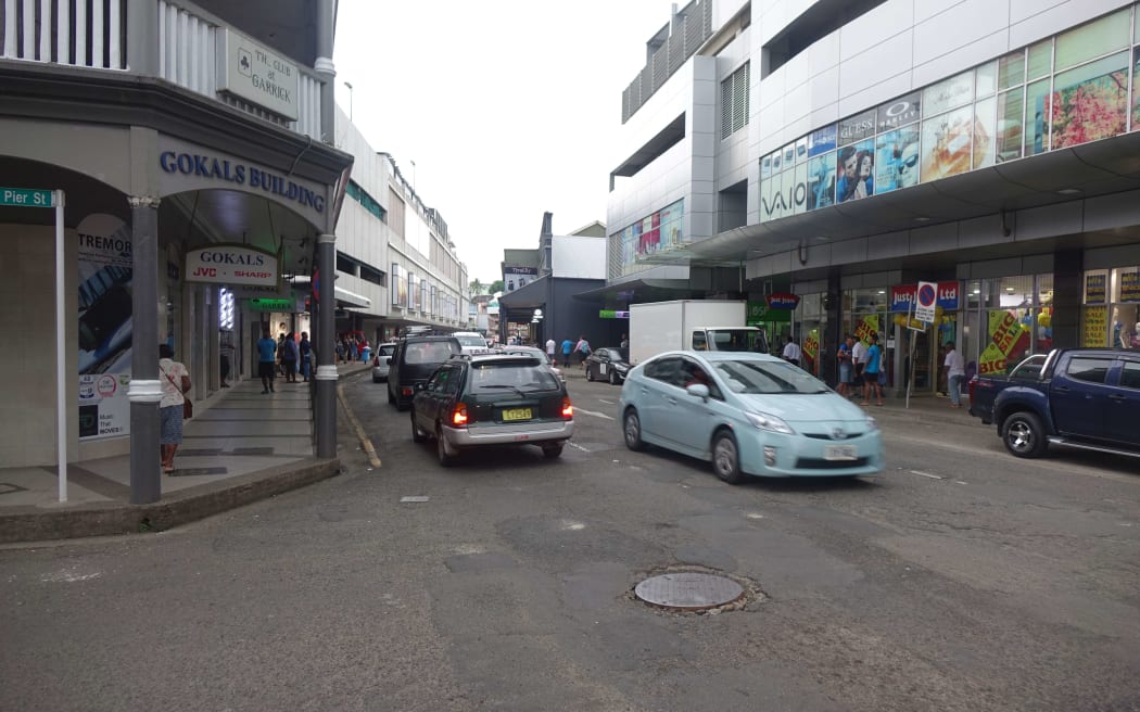 Traffic passes through the central business district of Fiji's capital, Suva.