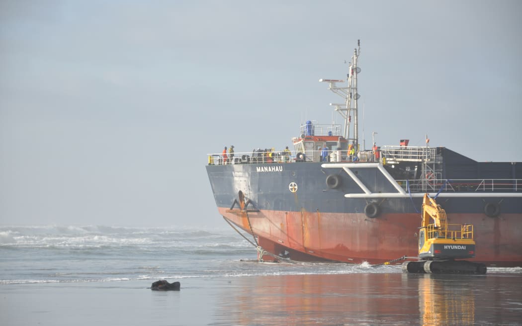 A digger works to help anchor the Manahau on Monday 2 September.