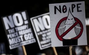 Protestors rally against white supremacy and racism in Columbus Circle on August 13, 2017 in New York City following clashes between white supremacists and counter-protestors in Charlottesville, Virginia.