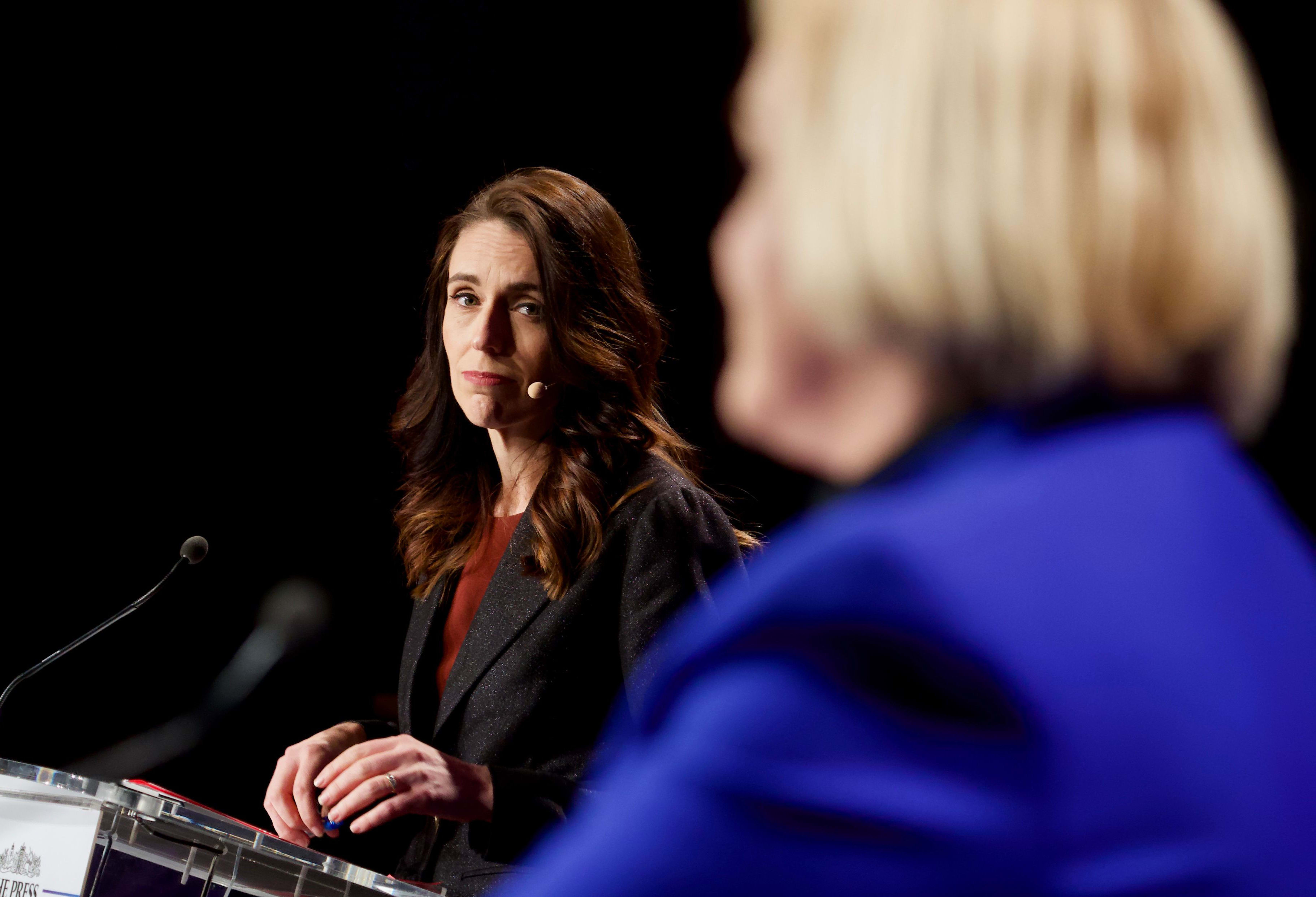Labour leader Jacinda Ardern looks on as National leader Judith Collins speaks at The Press debate in Christchurch.  06/10/20