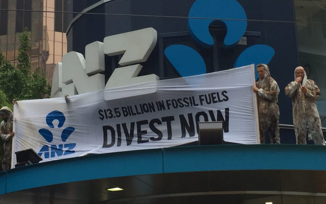 Protesters unfurled a banner on the ANZ building in central Wellington.