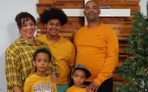 Alvin April and his wife Megon Dyson-April, and their three sons.