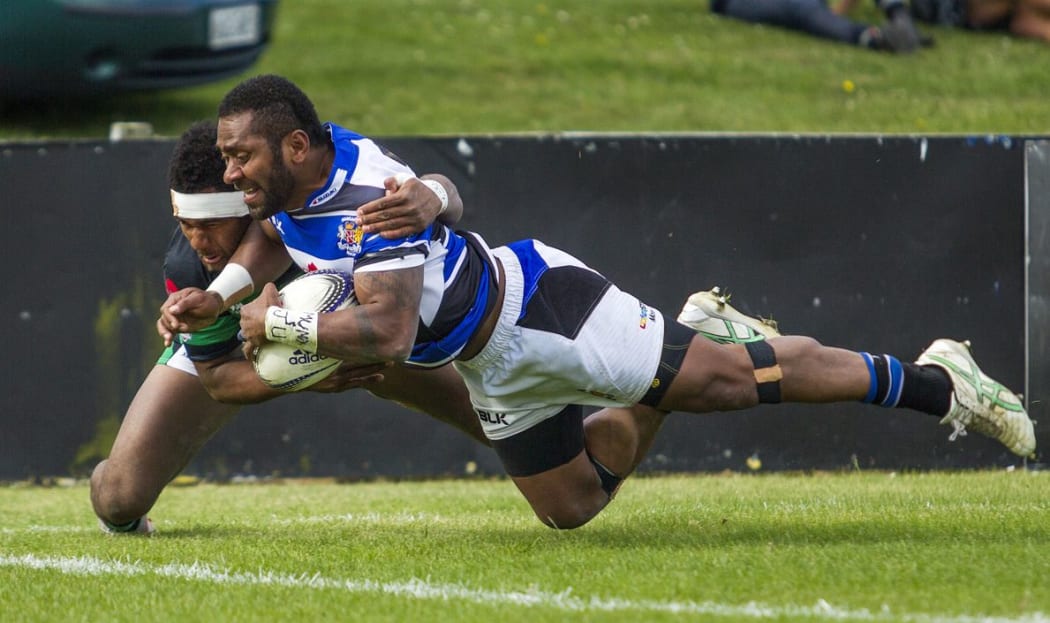 Michael Nabuliwaqe of Wanganui scores a try in the tackle of South Canterbury's Rupeni Cokanasiga during the Meads Cup final, South Canterbury v Wanganui held at Alpine Energy Stadium, Timaru. 24 October 2015 Photo: Joseph Johnson / www.photosport.nz
