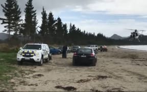 The helicopter spilled some of the liquid at a beach while refueling.