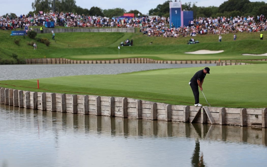 New Zealand's Ryan Fox competes in round 4 of the men’s golf individual stroke play of the Paris 2024 Olympic Games at Le Golf National in Guyancourt, south-west of Paris on August 4, 2024. (Photo by EMMANUEL DUNAND / AFP)