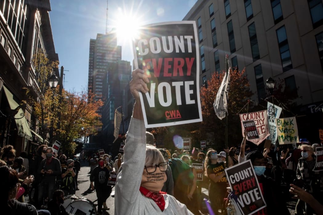 PHILADELPHIA, PENNSYLVANIA - NOVEMBER 05: A woman participates in a protest in support of counting all votes as the election in Pennsylvania is still remains too close to call on November 5, 2020 in Philadelphia, Pennsylvania.