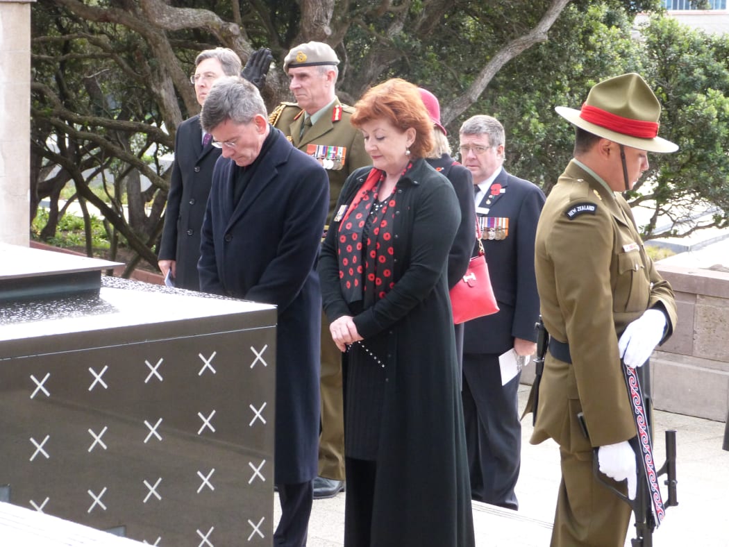Minister Maggie Barry and Attorney-General Chris Finlayson pay their respects at the tomb of the unknown warrior.