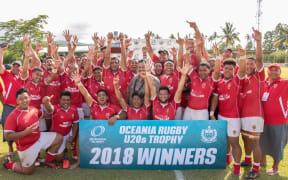 Tonga celebrate their win.