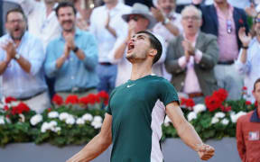 Carlos Alcaraz of Spain celebrates with the champion trophy after winning against Alexander Zverev of Germany during the Final ATP match during the Mutua Madrid Open 2022 celebrated at La Caja Magica