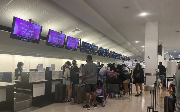 Passengers at check-in for the first flight to the Cook Islands.