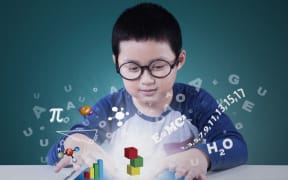 Stock shot of child using app for maths, science studies.