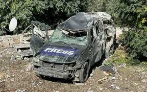This picture shows a car marked "Press" at the site of an Israeli airstrike that targeted an area where a number of journalists were located in the southern Lebanese village of Hasbaya on 25 October 2024.