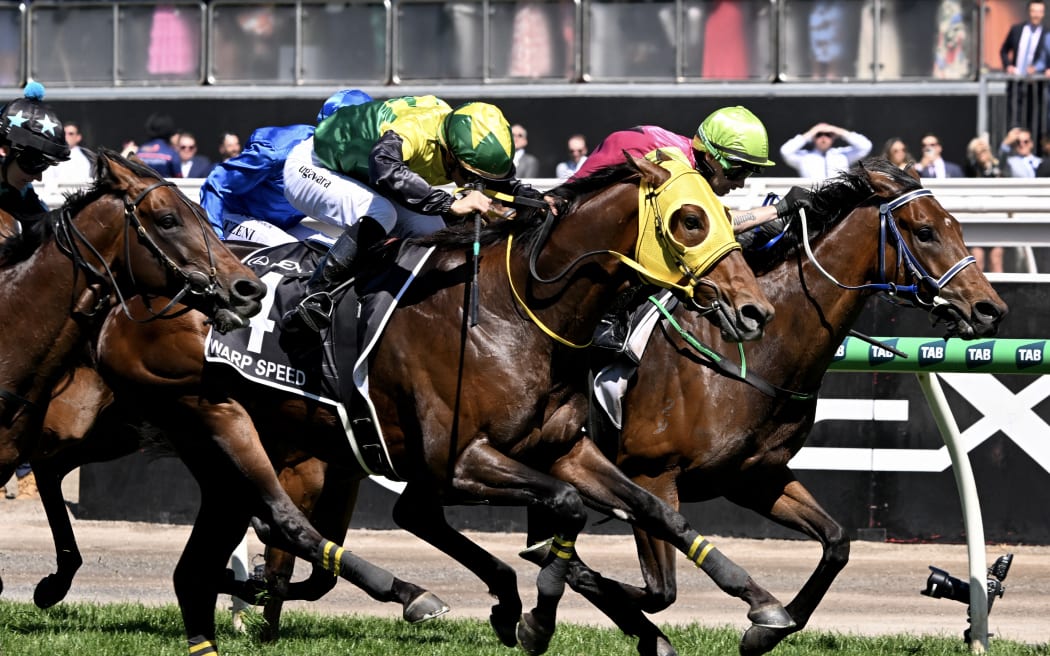 Knight's Choice, right, ridden by Robbie Dolan, wins the 2024 Melbourne Cup from Warp Speed at Flemington racecourse in Melbourne, November 5, 2024. (Photo by William WEST / AFP) / -- IMAGE RESTRICTED TO EDITORIAL USE - STRICTLY NO COMMERCIAL USE --)