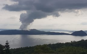 Taal volcano with ash plume