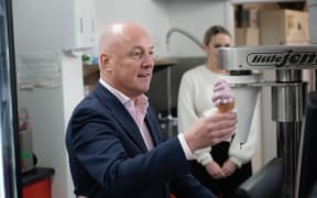 National leader Christopher Luxon makes an ice cream at Phil Grieg Strawberry Farm in Auckland on 26 September.