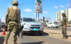 Fighters with the Saudi-backed coalition man a checkpoint in Dar Sad, north of Yemen's southern city of Aden on December 31, 2020.