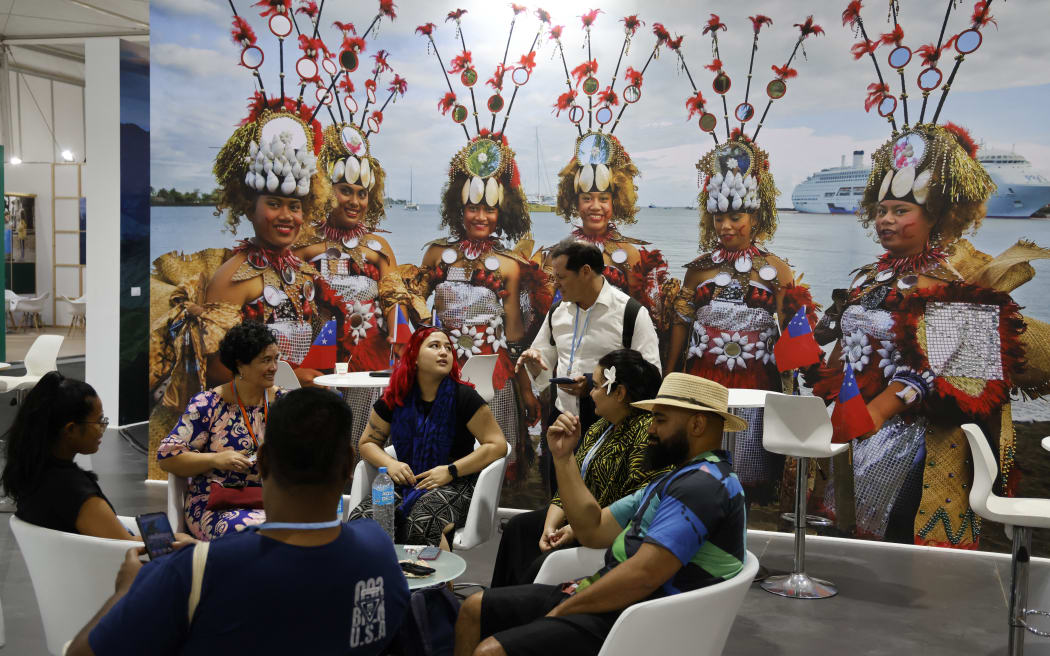 Participants and delegates meet in the Pacific Island pavillon at the Sharm El Sheikh International Convention Centre, on the first day of the COP27 climate summit, in Sharm el-Sheikh.