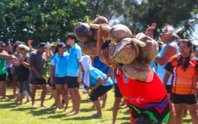 Competitors had to carry at least 12 coconuts for 25 metres.