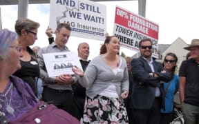 Residents with quake damaged homes protest thousands of unresolved  earthquake insurance claims.