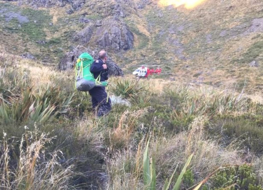 Senior Constable Jonathan Davies with the rescue helicopter.