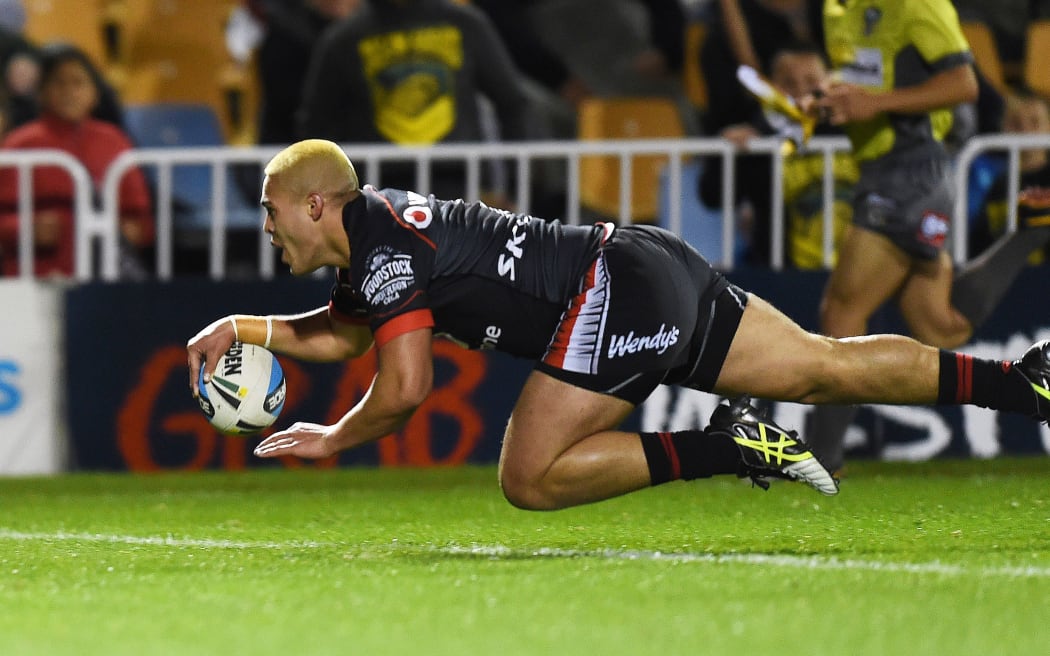 Warriors half Tuimoala Lolohea scores the opening try against the Cowboys