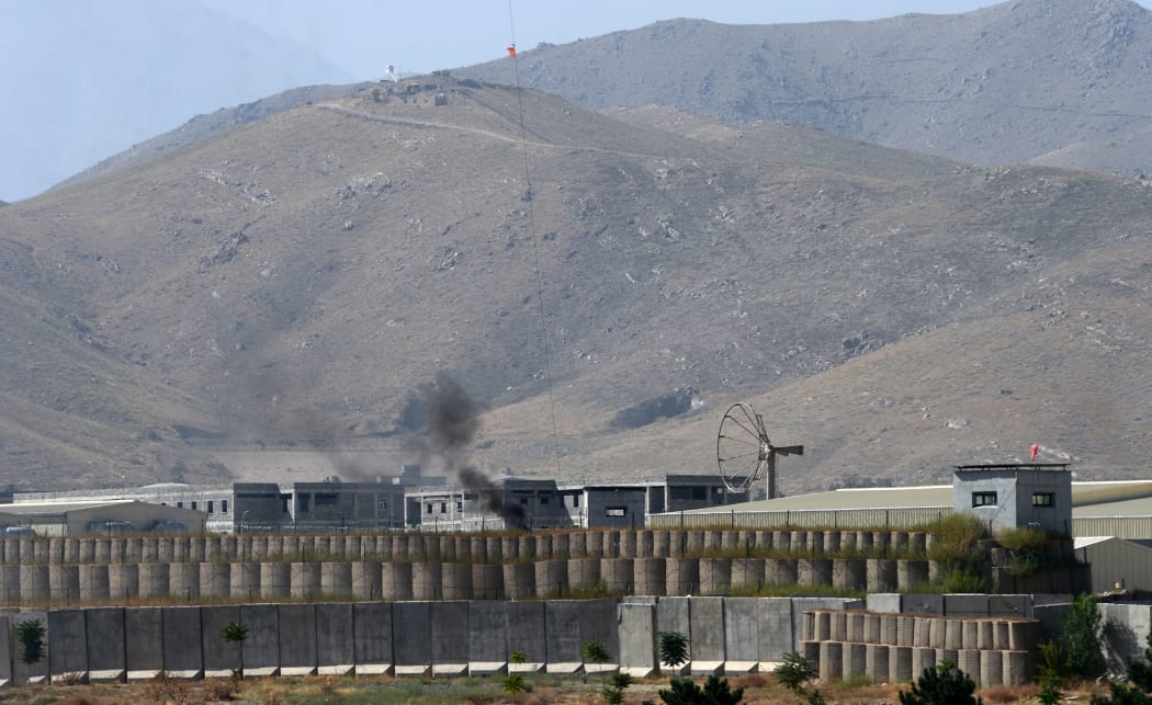 An Afghan soldier is reported to have opened fire on troops at a British-run military academy near Kabul.