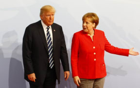 German Chancellor Angela Merkel welcomes US President Donald Trump during G20 Leaders' Summit in Hamburg.