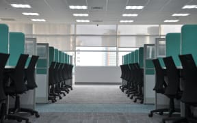 Empty office desks and chairs