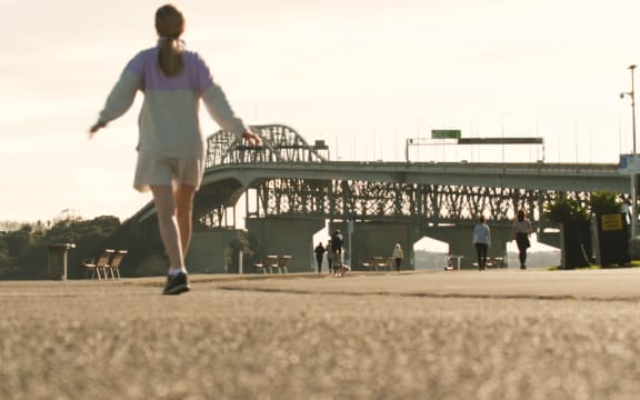 Exercise and social distancing near Auckland's Harbour Bridge during level 4 lockdown.