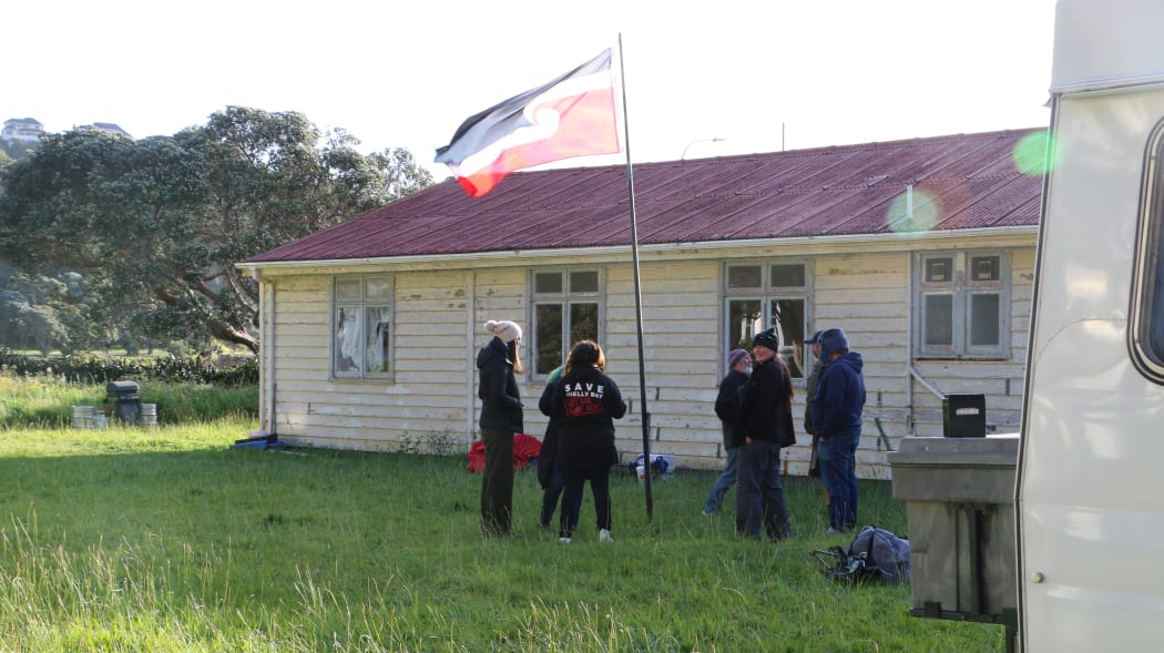 Mau Whenua supporters fly the Tino Rangatiratanga flag at an occupation of Wellington's Shelly Bay.